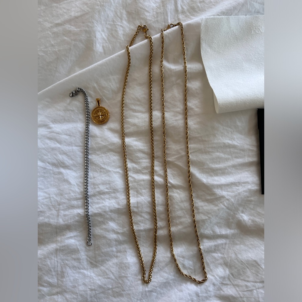 Four piece gold plated and silver necklace and bracelet set